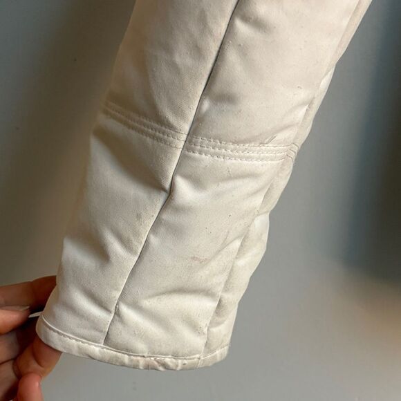 Obermeyer Women's Tuscany II Ski Jacket in white with black side panels. - Picture 5 of 8